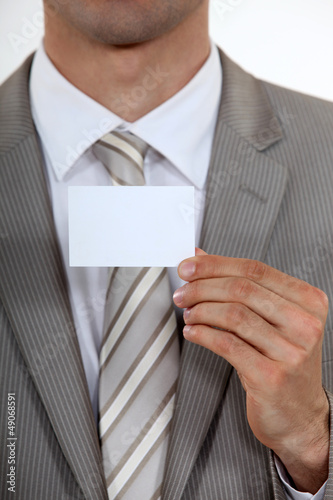 Photo: Executive with a blank business card Executive with a blank business card