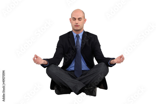 Photo: Businessman sat in yoga position Businessman sat in yoga position