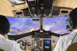 Pilots in the plane cockpit and sunset
