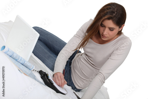 Photo: Woman with a laptop and diary Woman with a laptop and diary