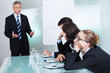 Photo: Bored businesswoman sleeping in a meeting Bored businesswoman sleeping in a meeting