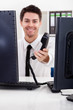 Smiling stock broker with telephone
