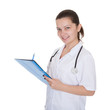 Cheerful young nurse writing a report