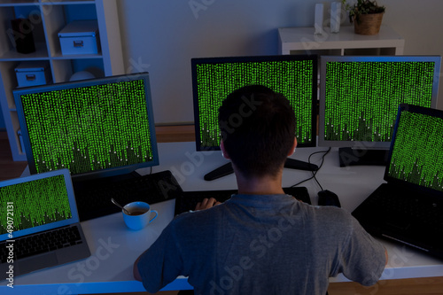 Photo: Hacker sitting streaming data Hacker sitting streaming data