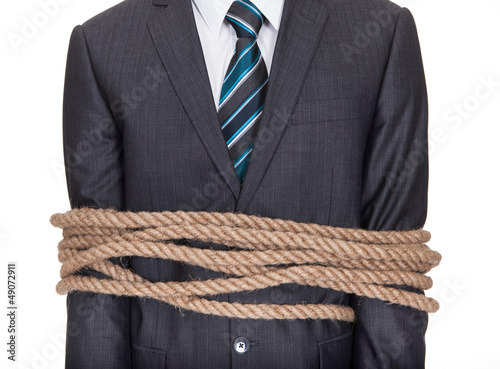 Photo: Businessman tied up in rope Businessman tied up in rope