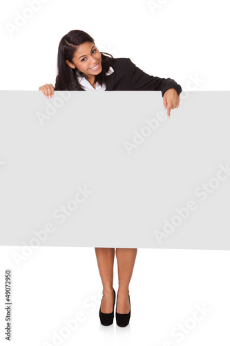 Photo: Happy Businesswoman Holding Placard Happy Businesswoman Holding Placard
