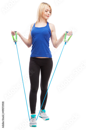 Photo: Woman exercising with a rubber band Woman exercising with a rubber band