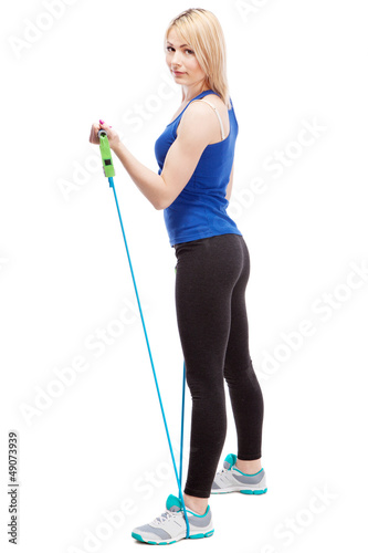 Photo: Woman exercising with a rubber band Woman exercising with a rubber band