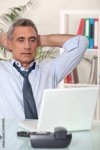 Photo: Senior man with his laptop Senior man with his laptop