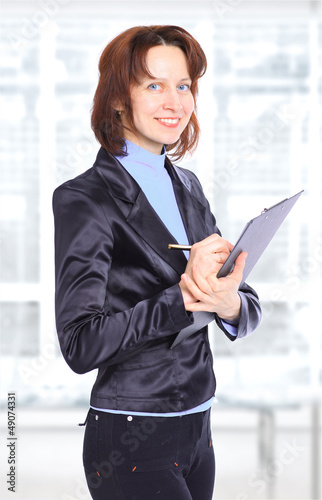 Photo: Nice business woman with the documents Nice business woman with the documents