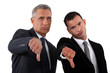 businessmen, thumbs down