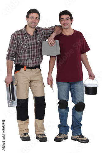 Photo: Two men preparing to tile bathroom Two men preparing to tile bathroom