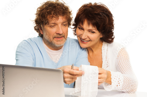 Photo: Checking up on shopping bill Checking up on shopping bill