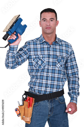 Photo: Workman with a sander Workman with a sander
