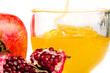 pomegranate and honey flowing in a cup