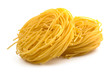 Italian egg pasta fettuccine nest isolated on white background