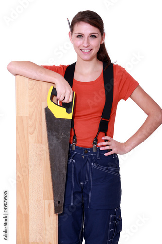 Photo: craftswoman holding a handsaw craftswoman holding a handsaw