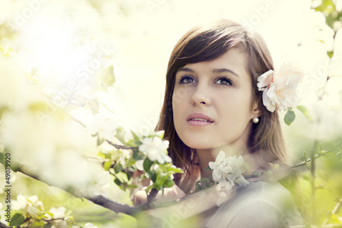 Photo: Young woman in the orchard Young woman in the orchard
