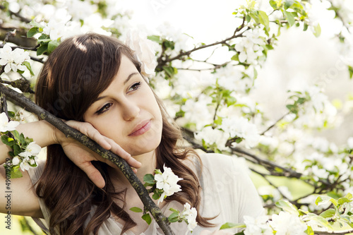 Photo: Happy young woman in the orchard Happy young woman in the orchard