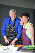 Foto: Married couple cooking together on the terrace Married couple cooking together on the terrace