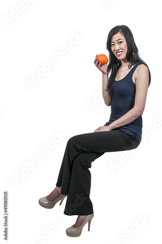 Photo: Woman Sitting on Orange Woman Sitting on Orange