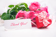 Roses and gift box with a card