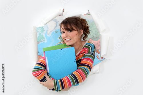 Photo: Student in front of a map Student in front of a map