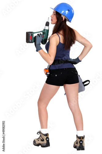 Photo: Woman holding drill Woman holding drill