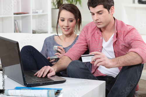 Photo: Couple shopping on the internet Couple shopping on the internet