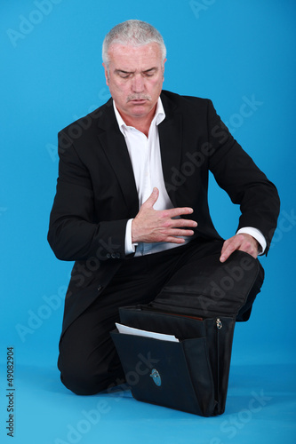 Photo: Businessman with an open briefcase Businessman with an open briefcase