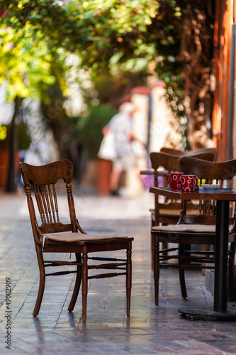 Photo: Empty coffee terrace with tables and chairs Empty coffee terrace with tables and chairs