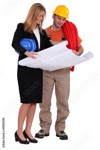 Photo: Architect and her foreman. Architect and her foreman.
