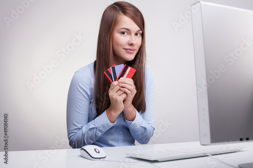 Photo: Young woman with credit cards Young woman with credit cards