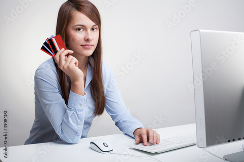 Photo: Young woman with credit cards Young woman with credit cards