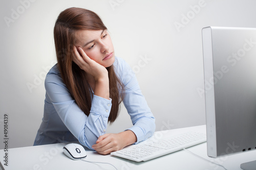 Photo: Beautiful woman tired at work Beautiful woman tired at work