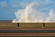 Huge waves crashing onto promenade