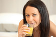 Brunette woman with orange juice