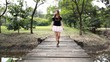 Beautiful african thai girl walking on a bridge