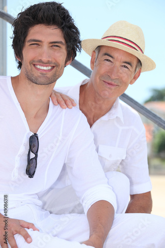 Photo: Father and son sitting on stairs Father and son sitting on stairs