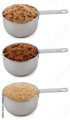Photo: Three different sugars in cup measures Three different sugars in cup measures