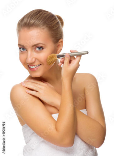 Photo: Young healthy girl with makeup brush Young healthy girl with makeup brush