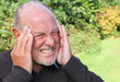 Senior man with headache migraine