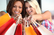 Women holding out their shopping bags