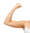 sporty woman flexing her biceps