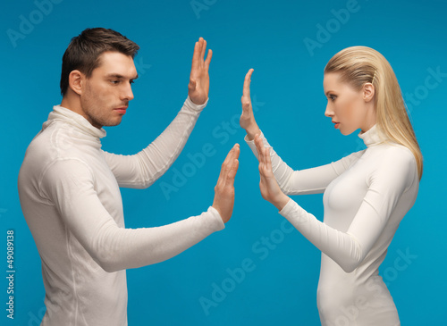 Photo: man and woman working with something imaginary man and woman working with something imaginary