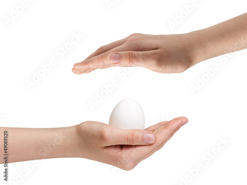 Photo: female teen hand holding egg female teen hand holding egg
