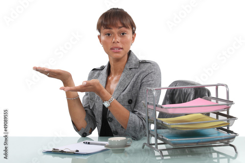 Photo: cute secretary at her desk cute secretary at her desk