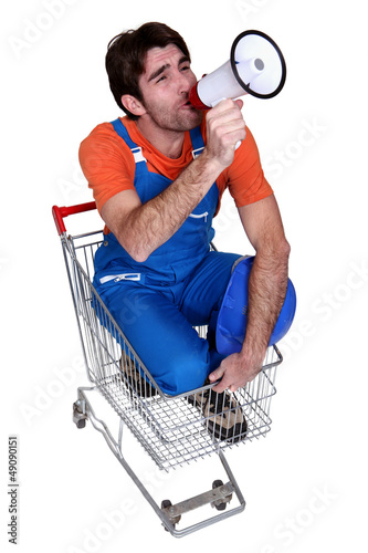 Photo: Man with a loudhailer in a trolley Man with a loudhailer in a trolley