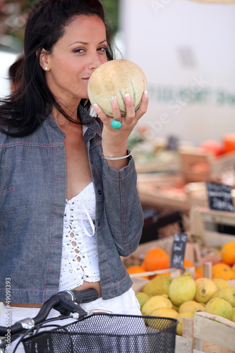 Photo: Woman buying fruit at market Woman buying fruit at market