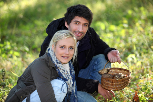 Photo: Couple with basket of mushrooms Couple with basket of mushrooms